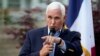 FILE - Former Vice President Mike Pence speaks to local residents on May 23, 2023, in Des Moines, Iowa. The Department of Justice said it won't  pursue criminal charges related to the discovery of classified documents at his Indiana home. 