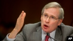 FILE - Then-national security adviser Stephen Hadley testifies on Capitol Hill in Washington, July 9, 2014, before the Senate Foreign Relations Committee.