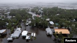 A drone view shows houses and streets flooded as Hurricane Debby affects the gulf coast in Suwannee, Florida, Aug. 5, 2024.