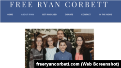 A screenshot of a page on a website dedicated to liberating Ryan Corbett, who stands in the back row of this family photo.