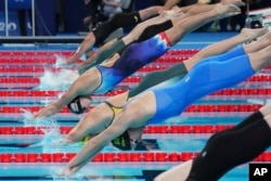 Swimmer Katie Ledecky takes off in the women's 800-meter freestyle final at the Summer Olympics in Nanterre, France, Aug. 3, 2024.