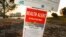 A health alert sign warns visitors to Sand Key Park of the presence of Red Tide in the surrounding water, March 9, 2023, in Pinellas County, Fla. 