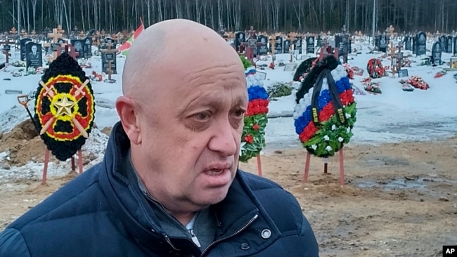 FILE - Wagner Group head Yevgeny Prigozhin attends the funeral of Dmitry Menshikov, a Wagner group fighter who died in Ukraine, at the Beloostrovskoye cemetery outside St. Petersburg, Russia, on Dec. 24, 2022.