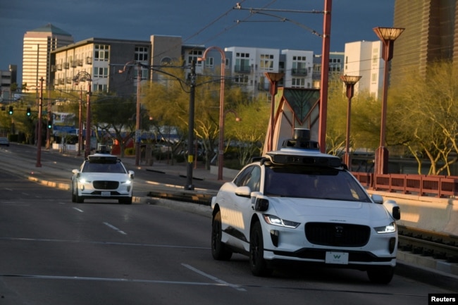 In this file photo, two Waymo autonomous vehicles drive themselves down Central Avenue in Phoenix, Arizona, U.S., March 18, 2024. (REUTERS/Caitlin O'Hara)