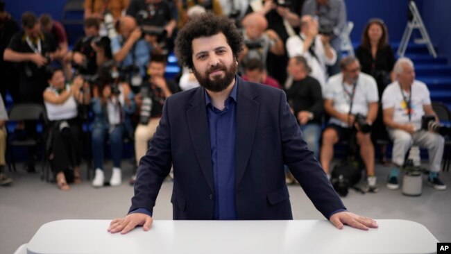 Director Saeed Roustaee poses for photographers at the photo call for the film "Leila's Brothers" at the 75th Cannes Film Festival in southern France, May 26, 2022.