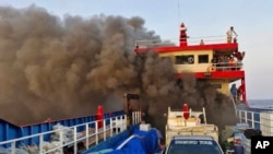 Smoke rises from a ferry in Surat Thani province, Thailand, April 4, 2024. 
