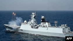FILE - The Pakistan Navy Ship (PNS) Taimur, a Type 054A ship designed and built for Pakistan by China, fires rounds during a naval exercise in the Arabian Sea near Pakistan's port city of Karachi on Feb. 13, 2023.