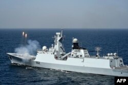 FILE - The Pakistan Navy Ship (PNS) Taimur, a Type 054A ship designed and built for Pakistan by China, fires rounds during a naval exercise in the Arabian Sea near Pakistan's port city of Karachi on Feb. 13, 2023.