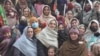 In this undated photo, Suriya Bibi poses with supporters in Chitral, Pakistan. Bibi made history in early February 2024 by becoming the first woman from the Chitral district to win an assembly seat through a direct election. (Photo courtesy of Azhar Uddin)