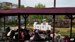 Syrian women gather in a public park in the Fatih district of Istanbul, Turkey, April 29, 2023. As Turkey began to grapple with a battered economy, calls for the return of refugees to Syria grew. It was a top theme in the May 14 elections.