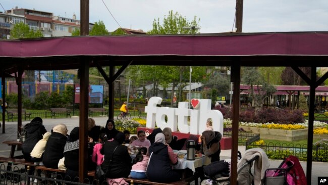Syrian women gather in a public park in the Fatih district of Istanbul, Turkey, April 29, 2023. As Turkey began to grapple with a battered economy, calls for the return of refugees to Syria grew. It was a top theme in the May 14 elections.