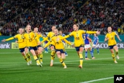 Sweden's Filippa Angeldal, second right, celebrates after scoring her side's second goal off a penalty kick during the Women's World Cup quarterfinal soccer match between Japan and Sweden at Eden Park in Auckland, New Zealand, Aug. 11, 2023.