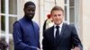 FILE - Senegal's President Bassirou Diomaye Faye (L) shakes hands with France's President Emmanuel Macron as they meet at the Elysee Presidential Palace in Paris, June 20, 2024.