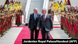 Jordan's King Abdullah II (R) receives Iraq's President Abdul Latif Rashid at Marka Airport in Jordan, April 15, 2024. King Abdullah said his country will not be a battleground for any party in the confrontation between Israel and Iran.