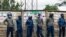FILE - Zimbabwe Republic Police line up to block Citizens Coalition for Change from holding an election campaign rally at Rudhaka Stadium in Marondera, March 12 2022. 