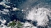 This GOES-16 GeoColor satellite image taken at 4:30 p.m. EDT and provided by National Oceanic and Atmospheric Administration shows Tropical Storm Ernesto over the Atlantic Ocean and moving west-northwest toward the Lesser Antilles, Aug. 12, 2024. 