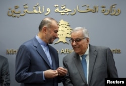 Iranian Foreign Minister Hossein Amirabdollahian speaks to Lebanon's caretaker Foreign Minister Abdallah Bou Habib during a joint press conference in Beirut, Lebanon, Oct. 13, 2023.