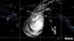 This satellite image provided by the National Oceanic and Atmospheric Administration (NOAA) shows Tropical Storm Hone was located near the Big Island in Hawaii as of 2:00 am HSST, Aug. 25, 2024, with moving west at 10 mph.