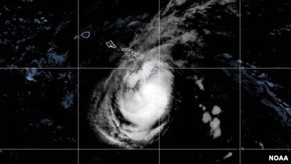This satellite image provided by the National Oceanic and Atmospheric Administration (NOAA) shows Tropical Storm Hone was located near the Big Island in Hawaii as of 2:00 am HSST, Aug. 25, 2024, with moving west at 10 mph.