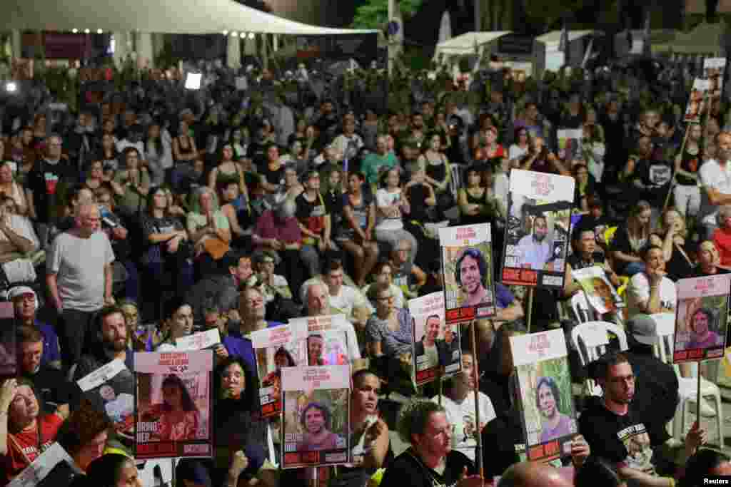 Israelis and hostage families watch a screening of Israeli Prime Minister Benjamin Netanyahu as he addresses Congress on a visit to the U.S. at the so-called "Hostages Square", in Tel Aviv, Israel, July 24, 2024. 