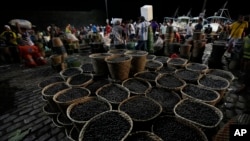 FILE - Baskets of acai are for sale at the Acai Fair at the Ver o Peso market in Belem, Brazil, Aug. 7, 2023.