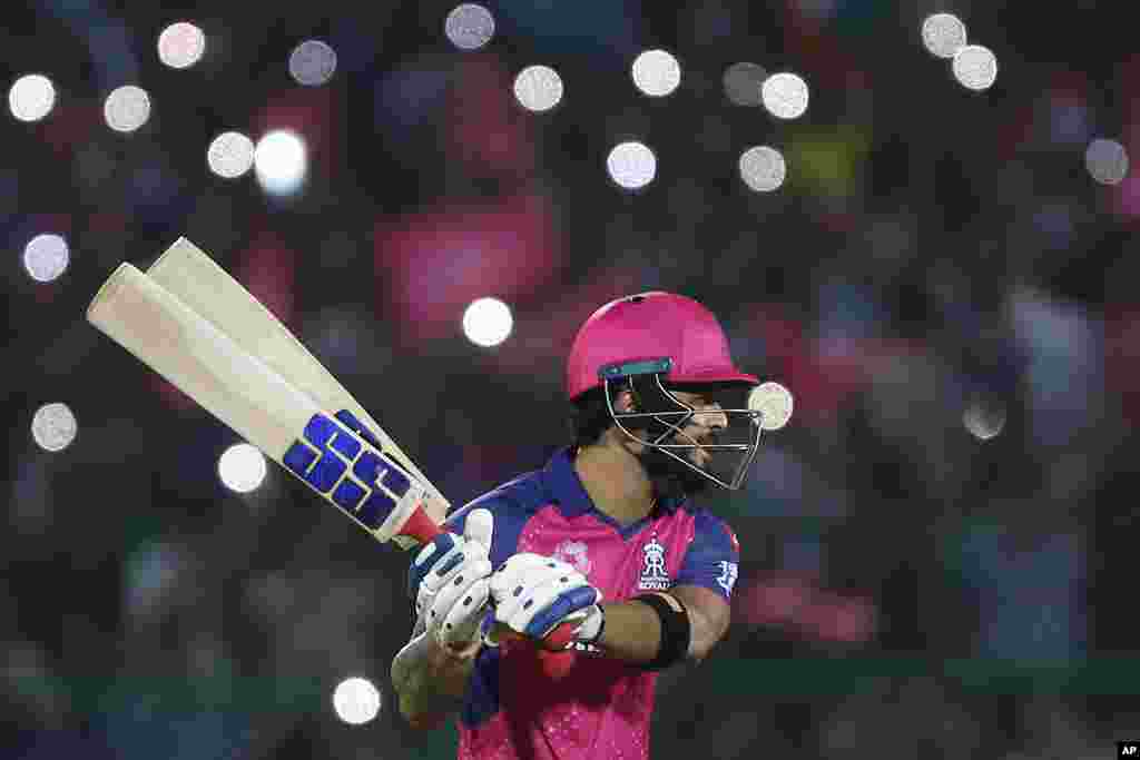 Rajasthan Royals' Riyan Parag selects a bat during the Indian Premier League cricket match between Gujarat Titans and Rajasthan Royals in Jaipur, India.