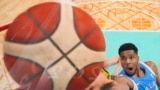 Giannis Antetokounmpo, of Greece, gets a lay-up against Australia in a men's basketball game at the 2024 Summer Olympics, in Villeneuve-d'Ascq, France. 