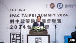 FILE - This handout picture taken and released on July 30, 2024 by Taiwan's Presidential Office shows Taiwan's President Lai Ching-te speaking to a meeting of the Inter-Parliamentary Alliance on China in Taipei.