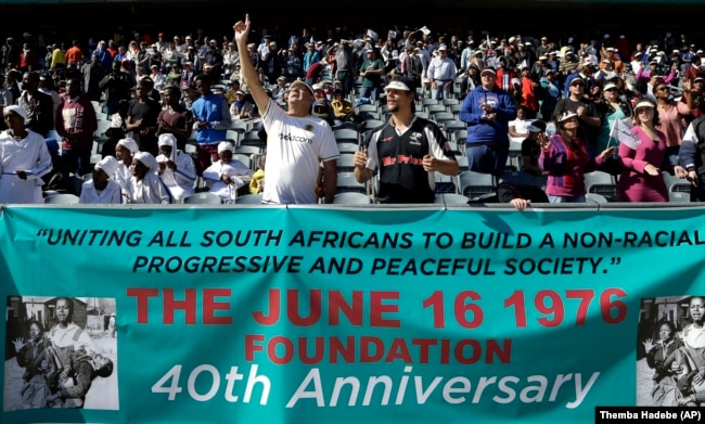 FILE - In this photo taken June 11, 2016 church members pray for victims of the June 1976 uprising as they prepare to march to mark the 40th anniversary in Soweto, South Africa. (AP Photo/Themba Hadebe, File)