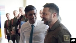 Britain's Prime Minister Rishi Sunak, left, and Ukraine President Volodymyr Zelenskyy meet at the Grand Prince Hotel, during the G7 Summit in Hiroshima, Japan, May 20, 2023.