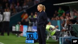 England's head coach Sarina Wiegman looks at the Women's World Cup round of 16 soccer match between England and Nigeria in Brisbane, Aug. 7, 2023. 