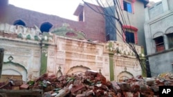 FILE - Debris remains from an Ahmadi mosque that was demolished by a mob on May, 24, 2018, in Sialkot, Pakistan. On July 27, 2024, unidentified gunmen killed an Ahmadi man in Gujaret, Pakistan, amid an increase in violence against the minority group.