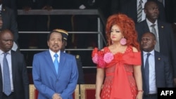 FILE - Cameroon President Paul Biya and his wife Chantal Biya attend the May 20 parade marking the 52nd celebration of Unity Day in Yaounde, May 20, 2024. Brenda Biya, the daughter of President Biya, declared she is a lesbian.