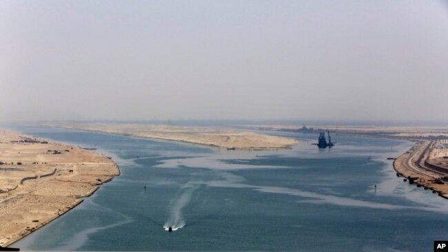 FILE - The entrance of the new section of the Suez Canal in Ismailia, Egypt, on Aug. 6, 2015.