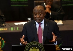 FILE - South African President Cyril Ramaphosa responds to a parliamentary debate on his state of the nation address in Cape Town, South Africa, Feb. 16, 2023.
