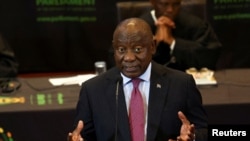 FILE - South African President Cyril Ramaphosa responds to a parliamentary debate on his state of the nation address in Cape Town, South Africa, Feb. 16, 2023.