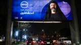 FILE - Vehicles move underneath a billboard showing an ad for the Egyptian television series "al-Hashashin" (The Assassins) along a road in Cairo's eastern suburb of Heliopolis, March 3, 2024. Iran just banned the broadcast of the television series.