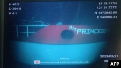 This handout photo taken March 21, 2023, by DPV Shin Nichi Maru and released courtesy of the Philippine Coast Guard shows a monitor with footage of the sunken oil tanker MT Princess Empress as it lies on the ocean floor off Naujan, Philippines.
