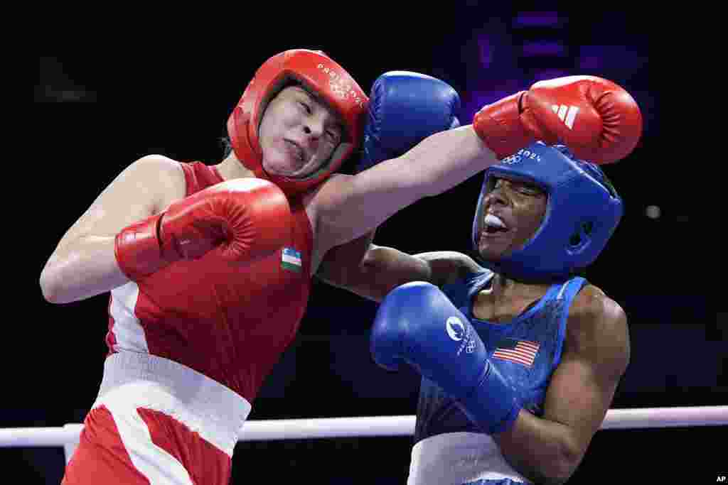 Uzbekistan&#39;s Navbakhor Khamidova, left, fights United States&#39; Morelle Mccane in their women&#39;s 66kg preliminary boxing match at the 2024 Summer Olympics in Paris, France.