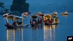 Delegates from the Group of 20 nations attending a tourism meeting enjoy boat ride at the Dal Lake in Srinagar, Indian controlled Kashmir, May 22, 2023. 