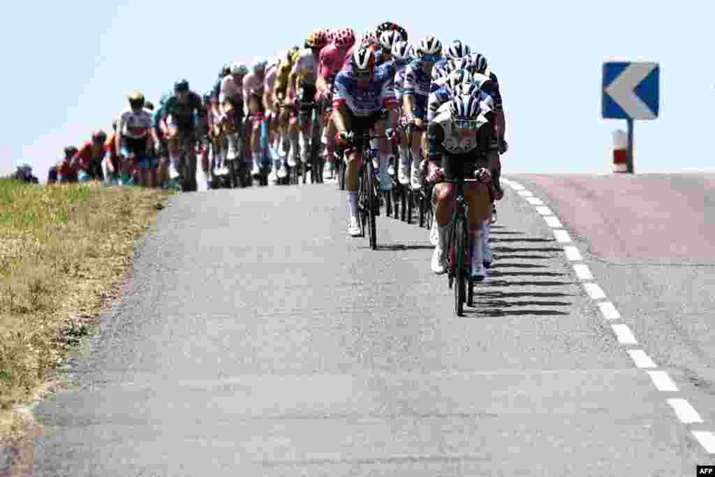 The pack rides during the fifth stage of the 75th edition of the Criterium du Dauphine cycling race, 191,5km between Cormoranche-sur-Saone and Salins-Les-Bains, France.