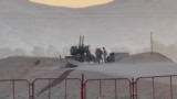 Personil militer berjaga di fasilitas nuklir di daerah Zardanjan di Isfahan, Iran, 19 April 2024, dalam tangkapan layar yang diambil dari video. WANA (Kantor Berita Asia Barat) via REUTERS