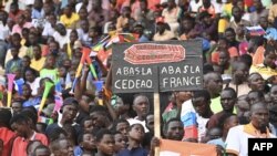 Tens of thousands rally in Niamey to show support for the military leaders behind last month's coup, Aug. 26, 2023.