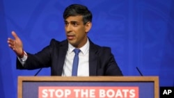 FILE - British Prime Minister Rishi Sunak speaks at Downing Street in London, April 22, 2024. Sunak pledged April 29 that the country's first deportation flights to Rwanda could leave in 10 to 12 weeks.