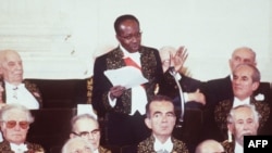 FILE - Poet and former President of Senegal Léopold Sédar Senghor speaks to members of the Académie Française during a reception as a new member in Paris on March 29, 1984.