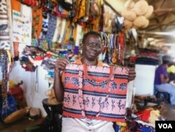 Woman selling various wares in Victoria Falls