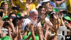Pope Francis meets with thousands of World Youth Day volunteers at Passeio Marítimo in Algés, just outside Lisbon, Portugal.