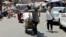 A worker pulls a cart loaded with goods at the Shorja wholesale market, amid high temperatures in Baghdad, Aug. 8, 2023. 