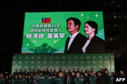 Photo of Taiwan's president-elect Lai Ching-te and his running mate Hsiao Bi-khim outside the Democratic Progressive Party (DPP) headquarters in Taipei on January 13, 2024. (Photo: AFP)