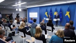 Prime Minister Ulf Kristersson and Minister of Justice Gunnar Strommer during a press meeting regarding the security policy situation where they presented measures to protect Swedish citizens, Aug. 1, 2023. (TT News Agency/Caisa Rasmussen via Reuters) 